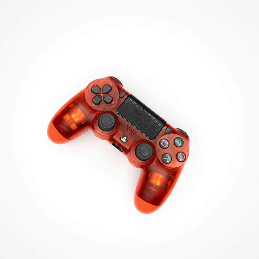red and black ps 4 game controller
