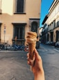 person holding ice cream cone