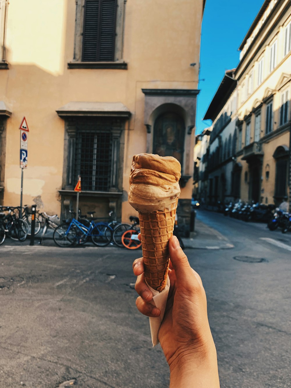 person holding ice cream cone