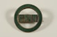 a green and gold pin with the word pint on it