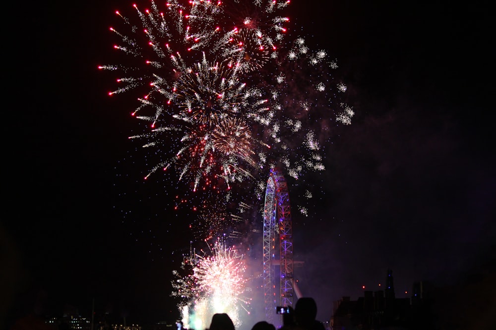 fireworks display over city during night time