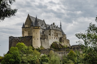 grey concrete castle under grey sky