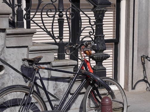 a bicycle parked on the side of a building