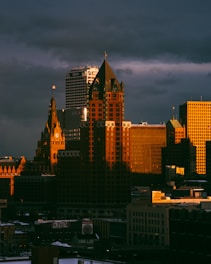 city skyline under gray cloudy sky during daytime