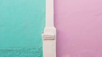 white leather strap on green wall