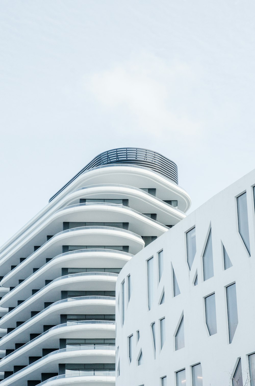 white concrete building under white sky during daytime