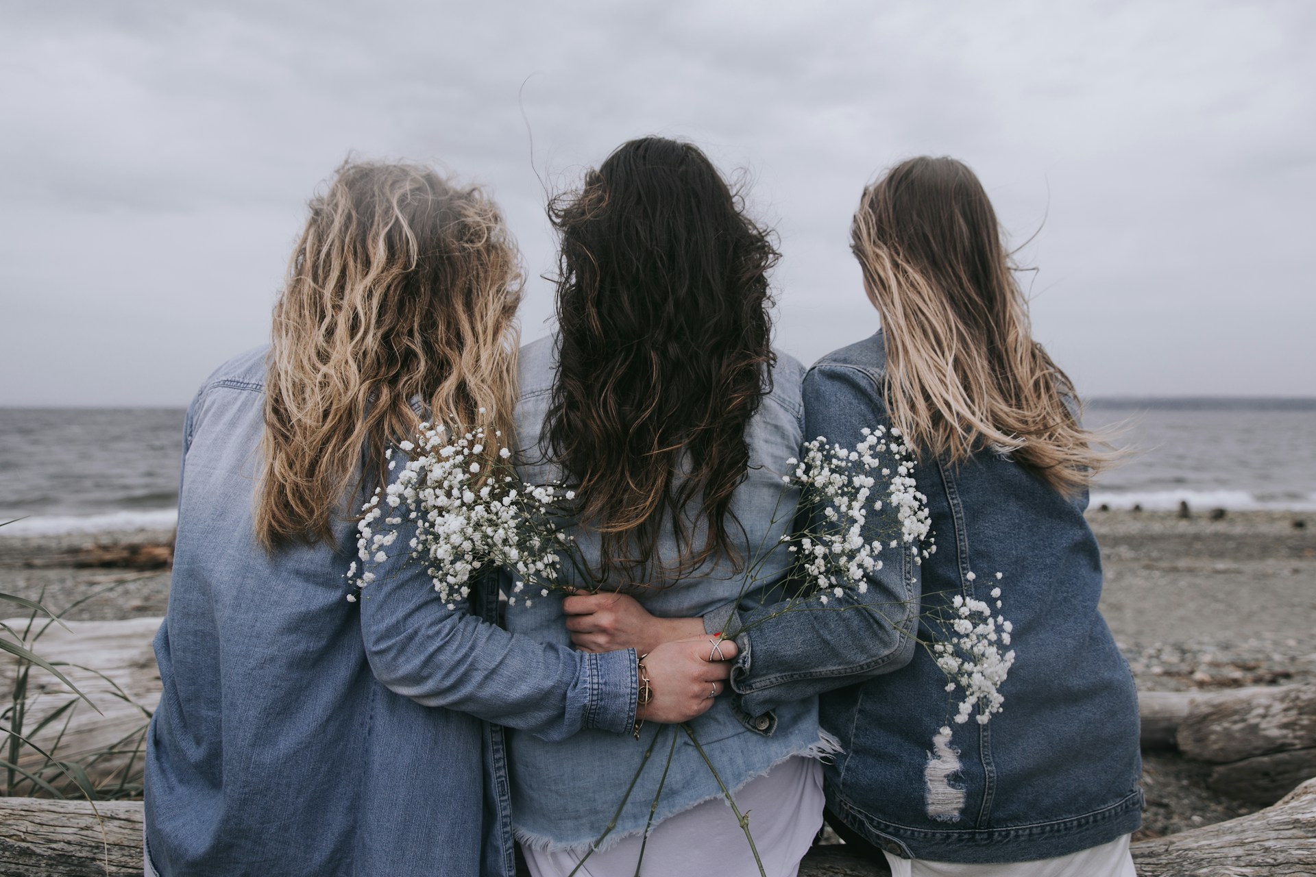 2 women in blue denim jacket