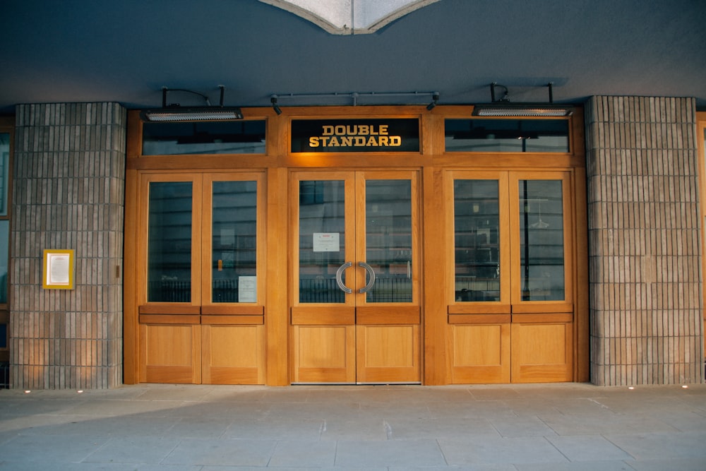 brown wooden door with glass panel