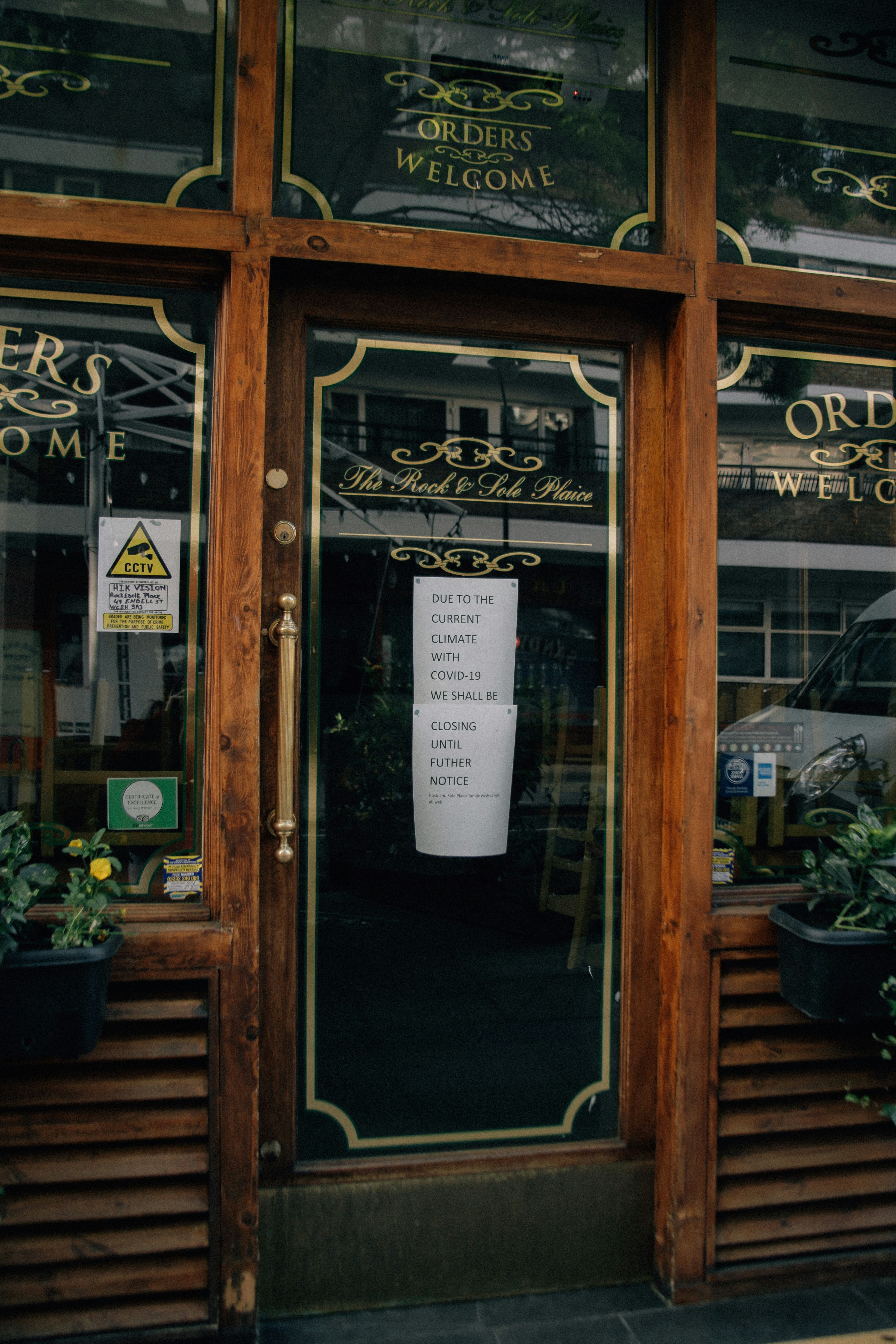 brown wooden framed glass door