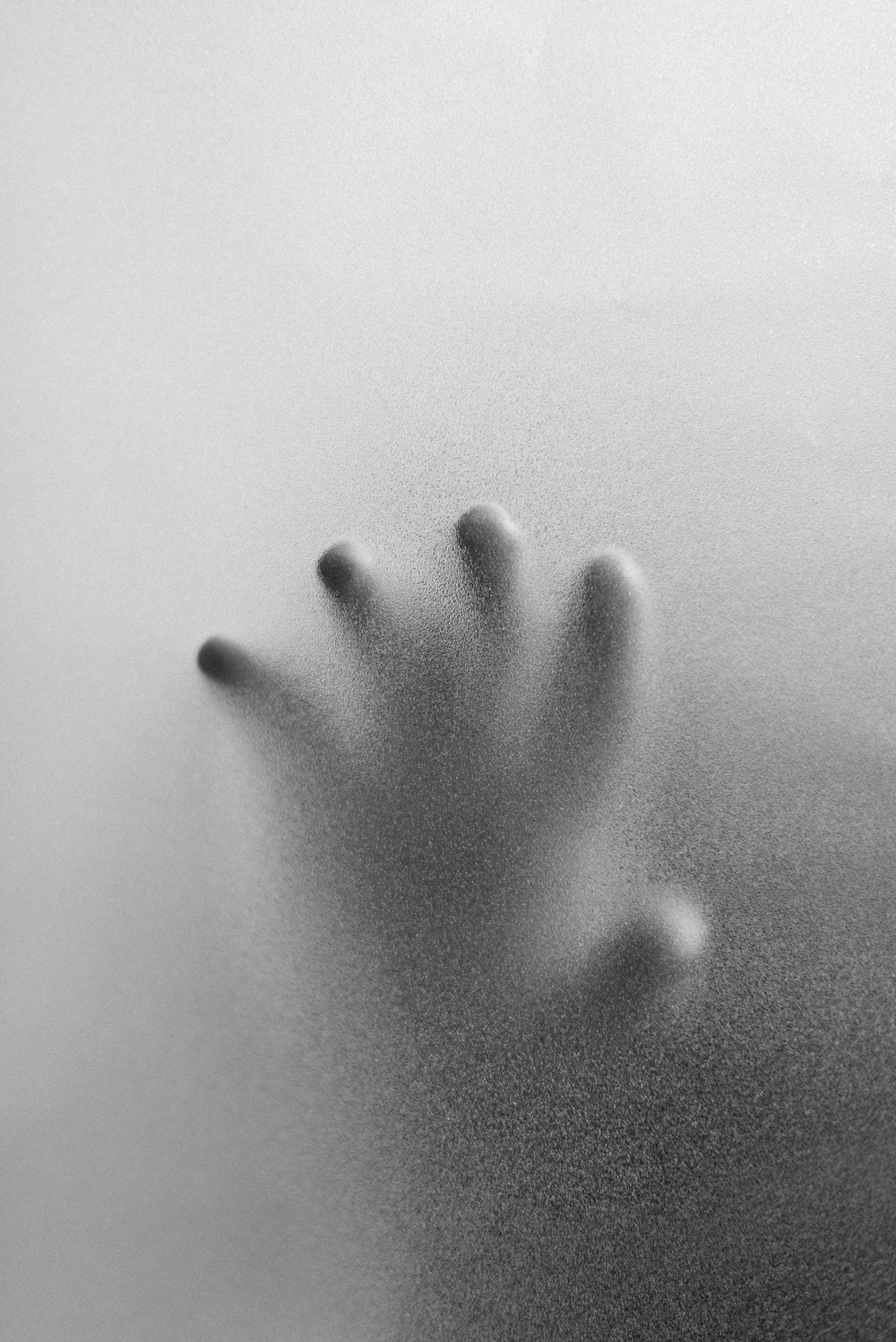 grayscale photo of persons right hand