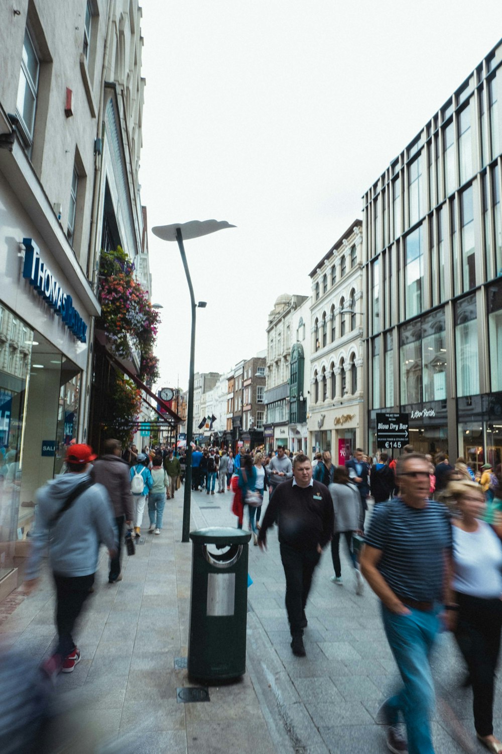 people walking on sidewalk during daytime