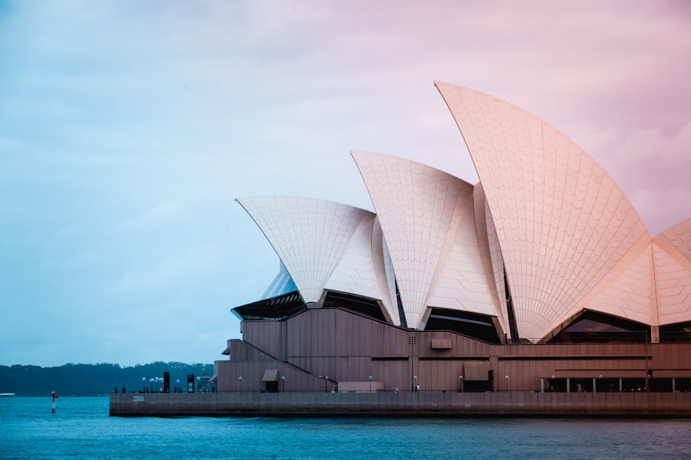 sydney opera house near body of water during daytime