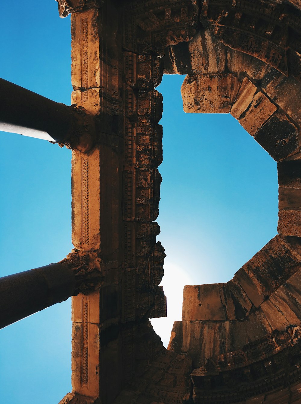 brown concrete arch under blue sky during daytime