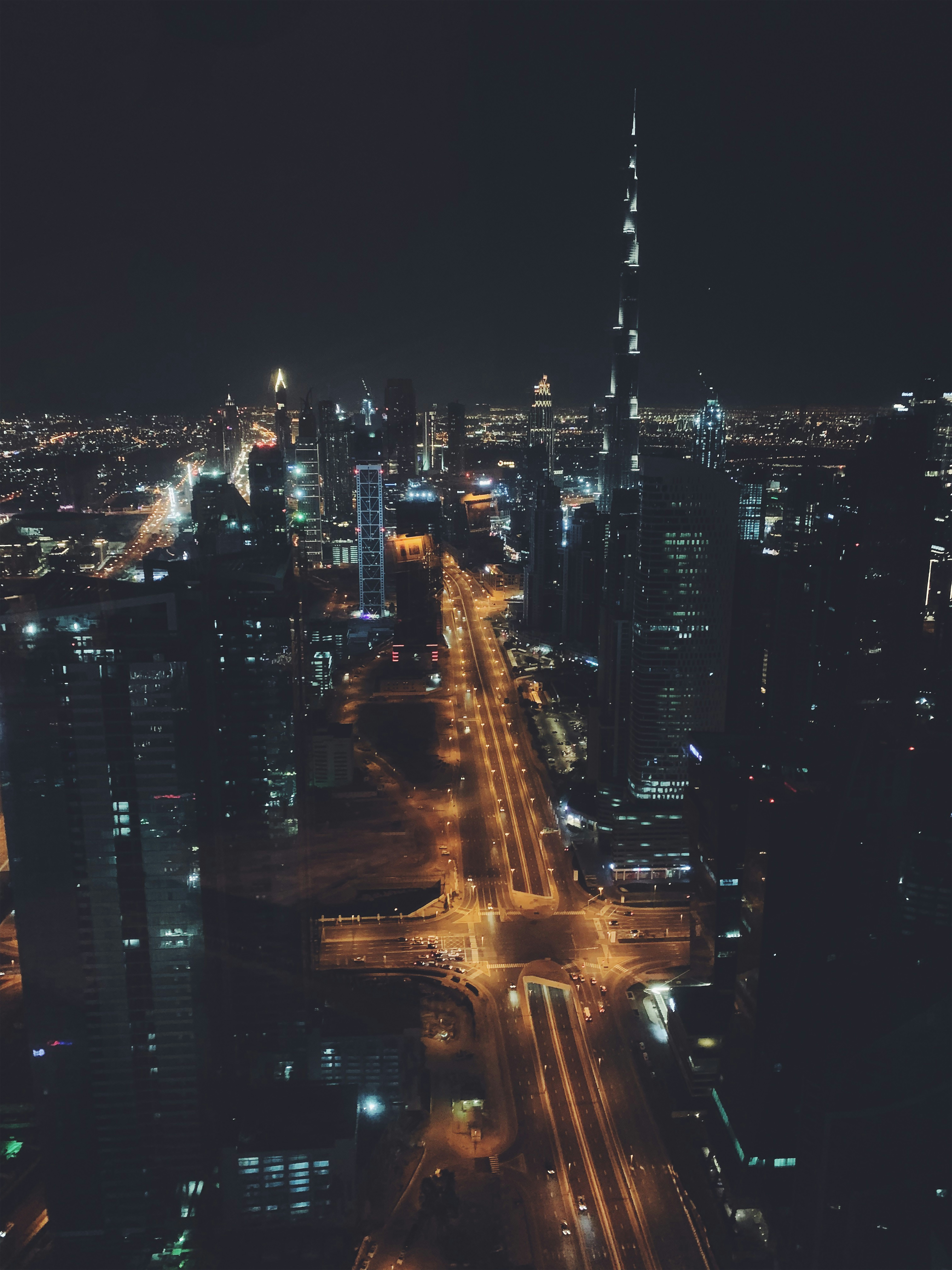 city with high rise buildings during night time