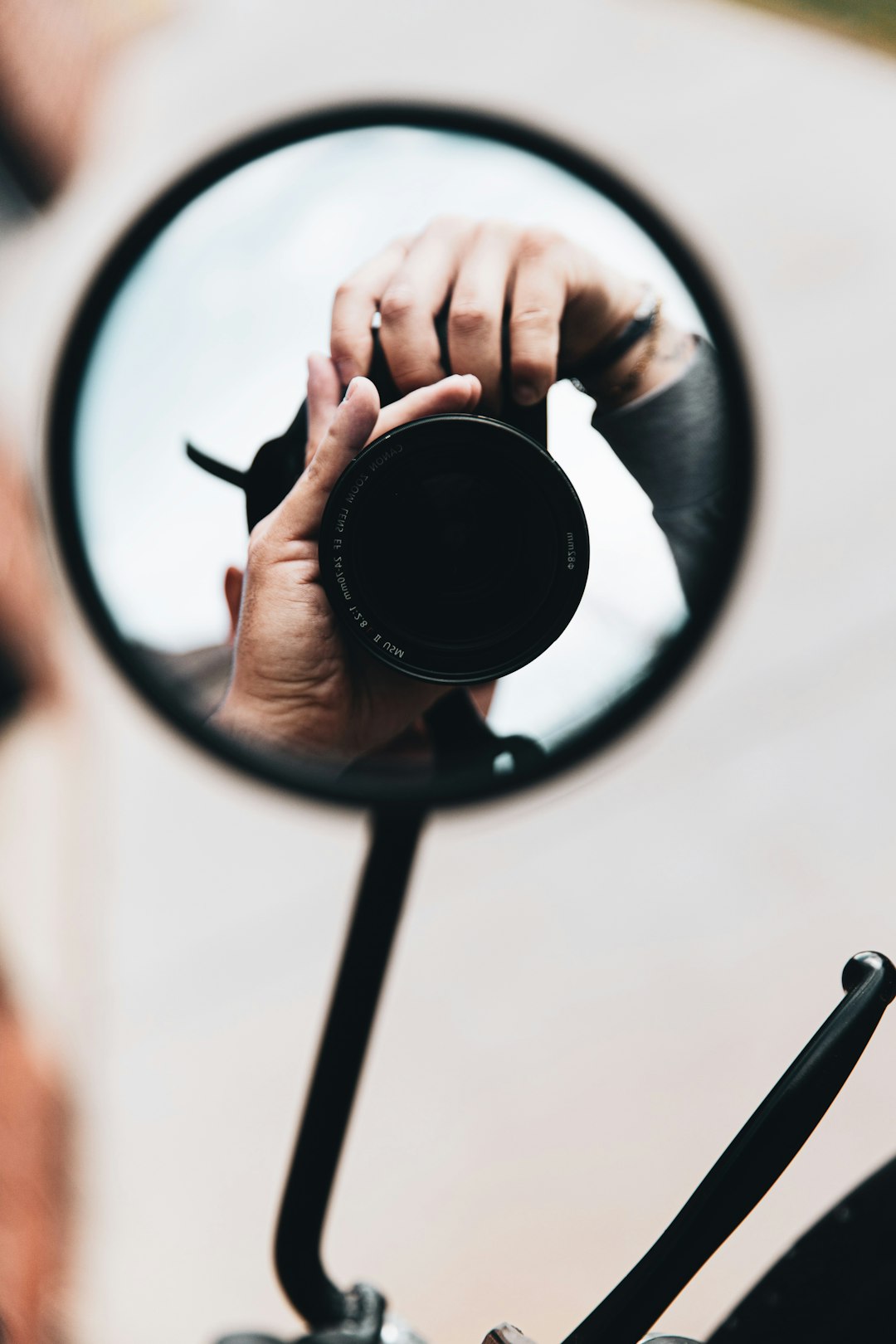 person holding black round frame