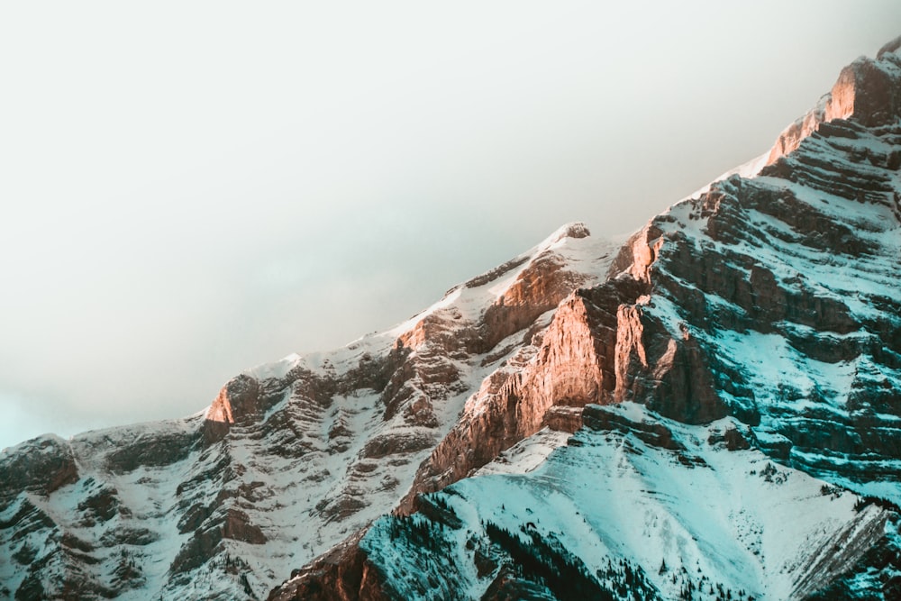 snow covered mountain during daytime