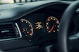 A detailed shot of a dashboard being repaired with precision instruments.