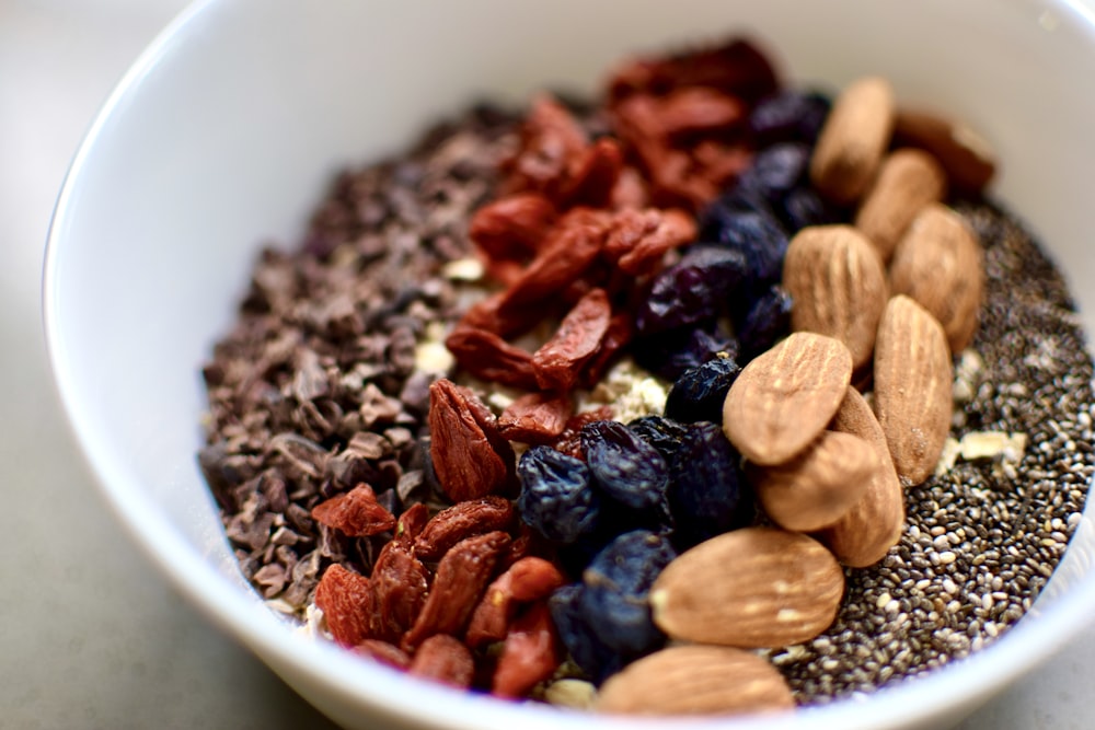 brown and black round food on white ceramic bowl