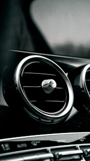 Zanvy cooler clipped to a car dashboard with cool mist in a sunny setting