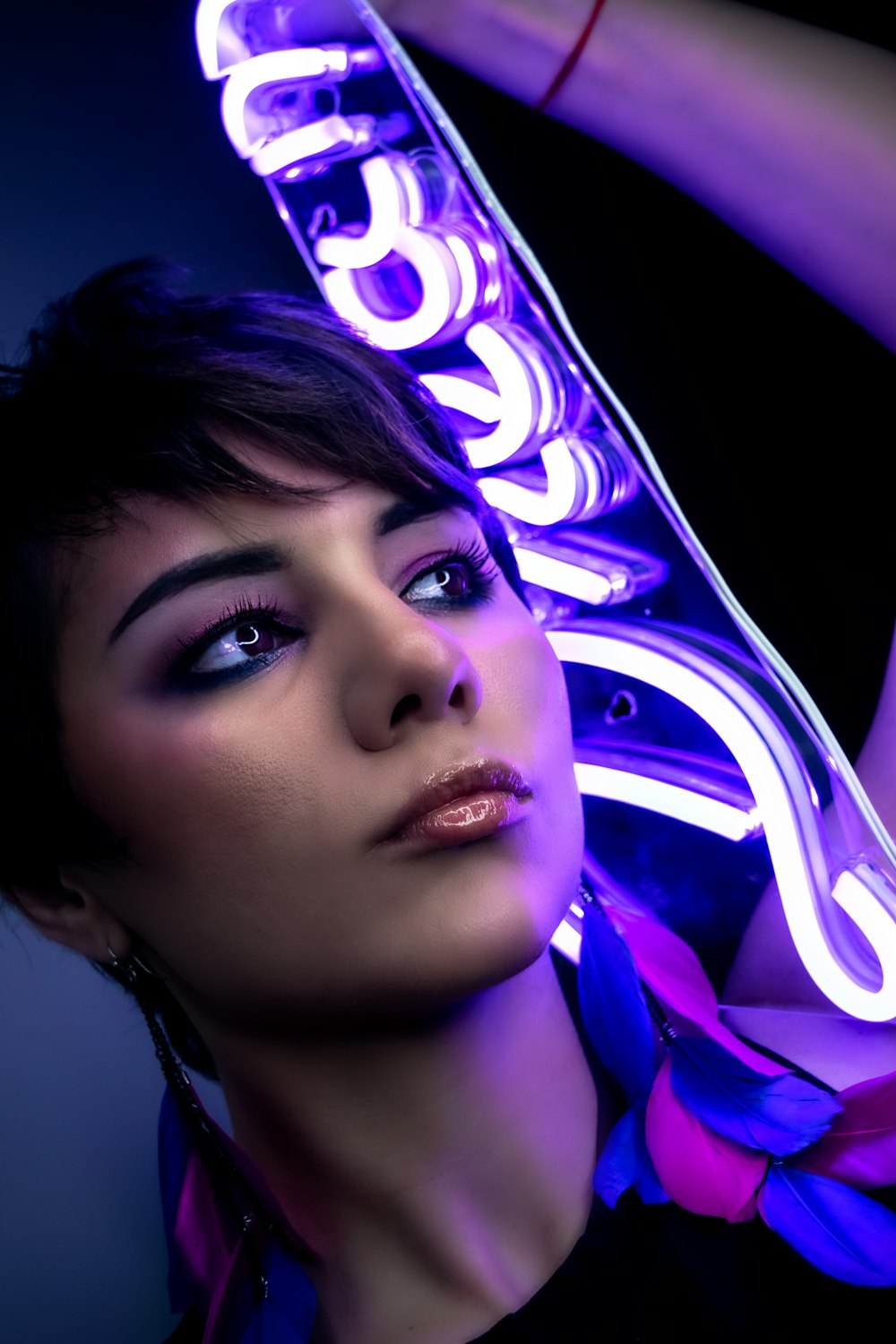 woman with purple and blue light on her face