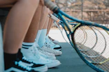Group of players warming up together with rackets in hand, ready for a game.