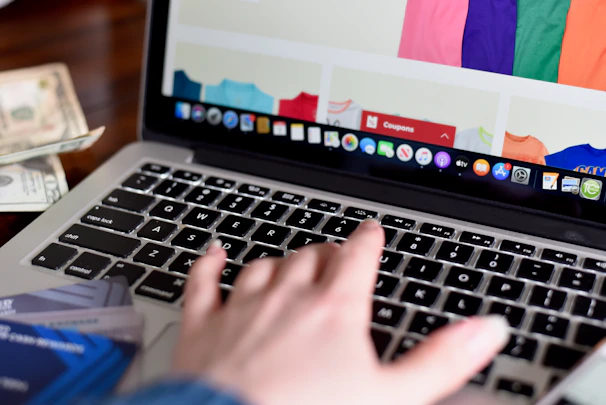 person using macbook pro turned on displaying game application