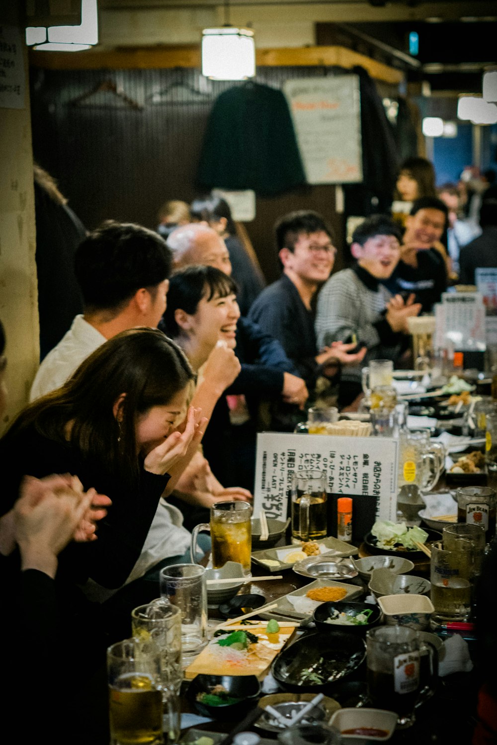 man and woman kissing in front of table