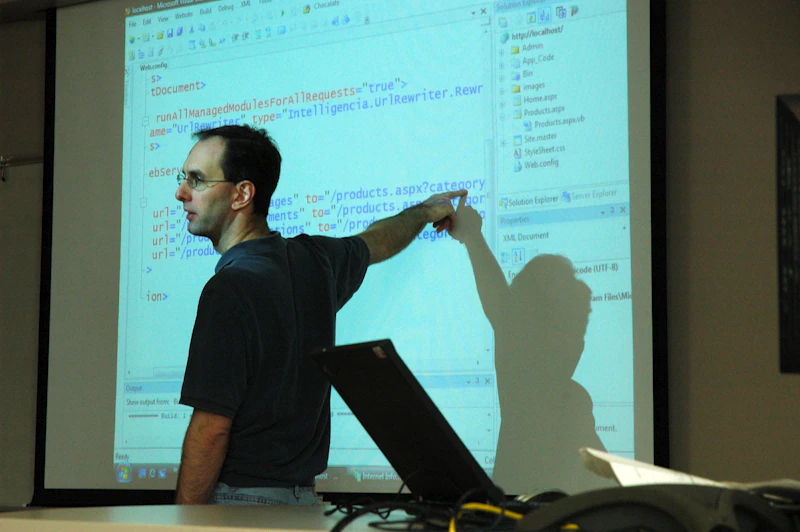 A faculty member walking students through a concept