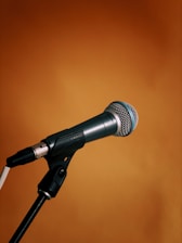 black and gray microphone on microphone stand