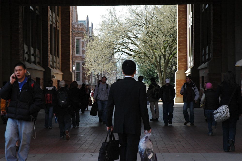 people walking on sidewalk during daytime