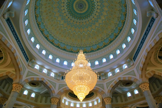 gold and blue dome ceiling in Hazrat Sultan Mosque Kazakhstan