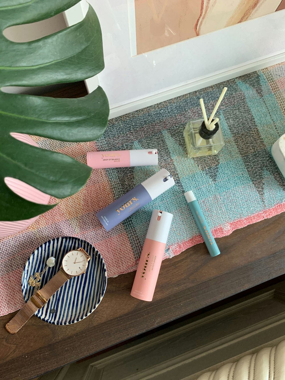 white and pink hair brush on glass table