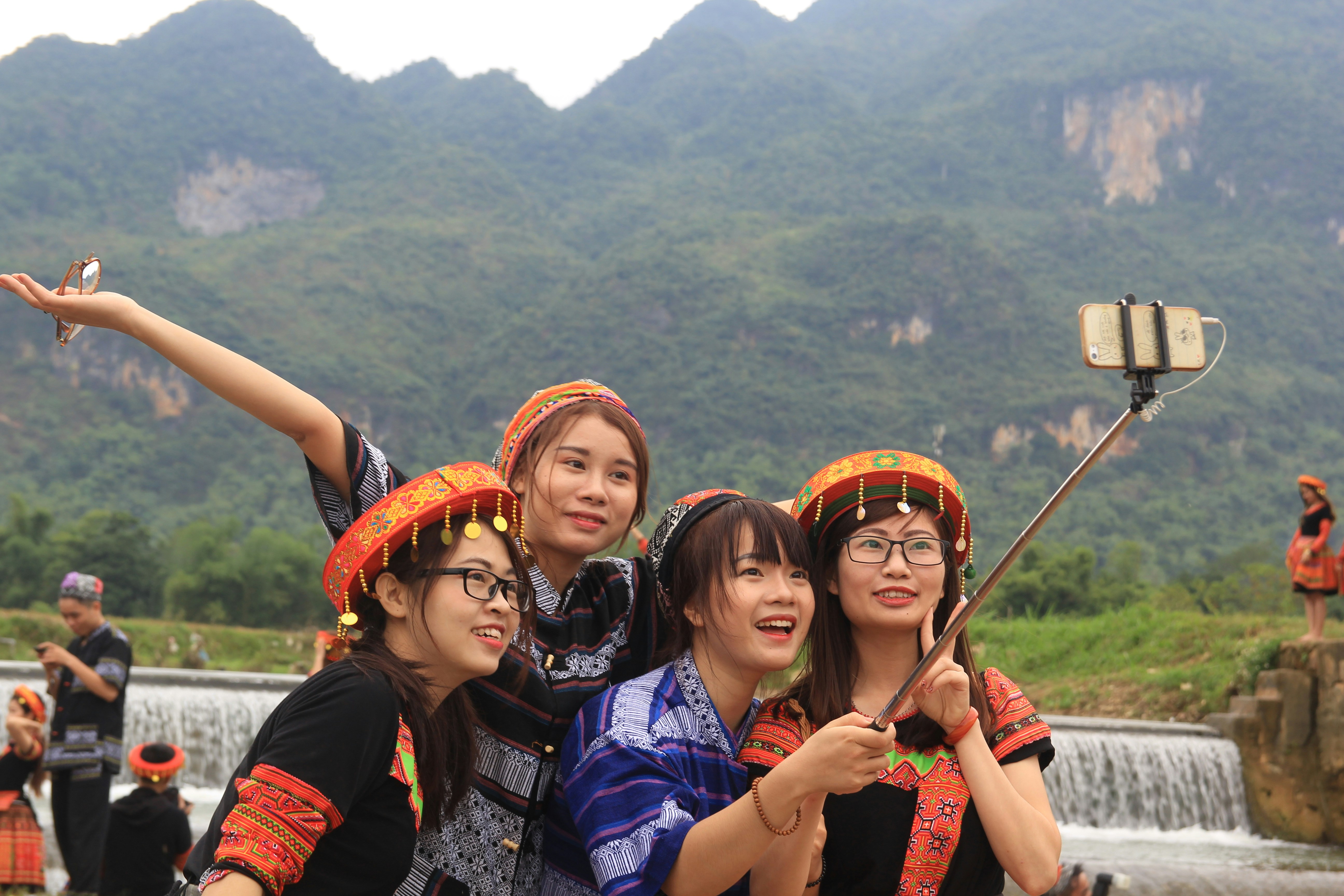 group of people taking photo during daytime