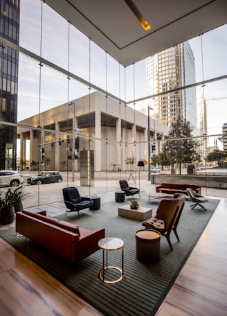 brown wooden chairs and table near glass window