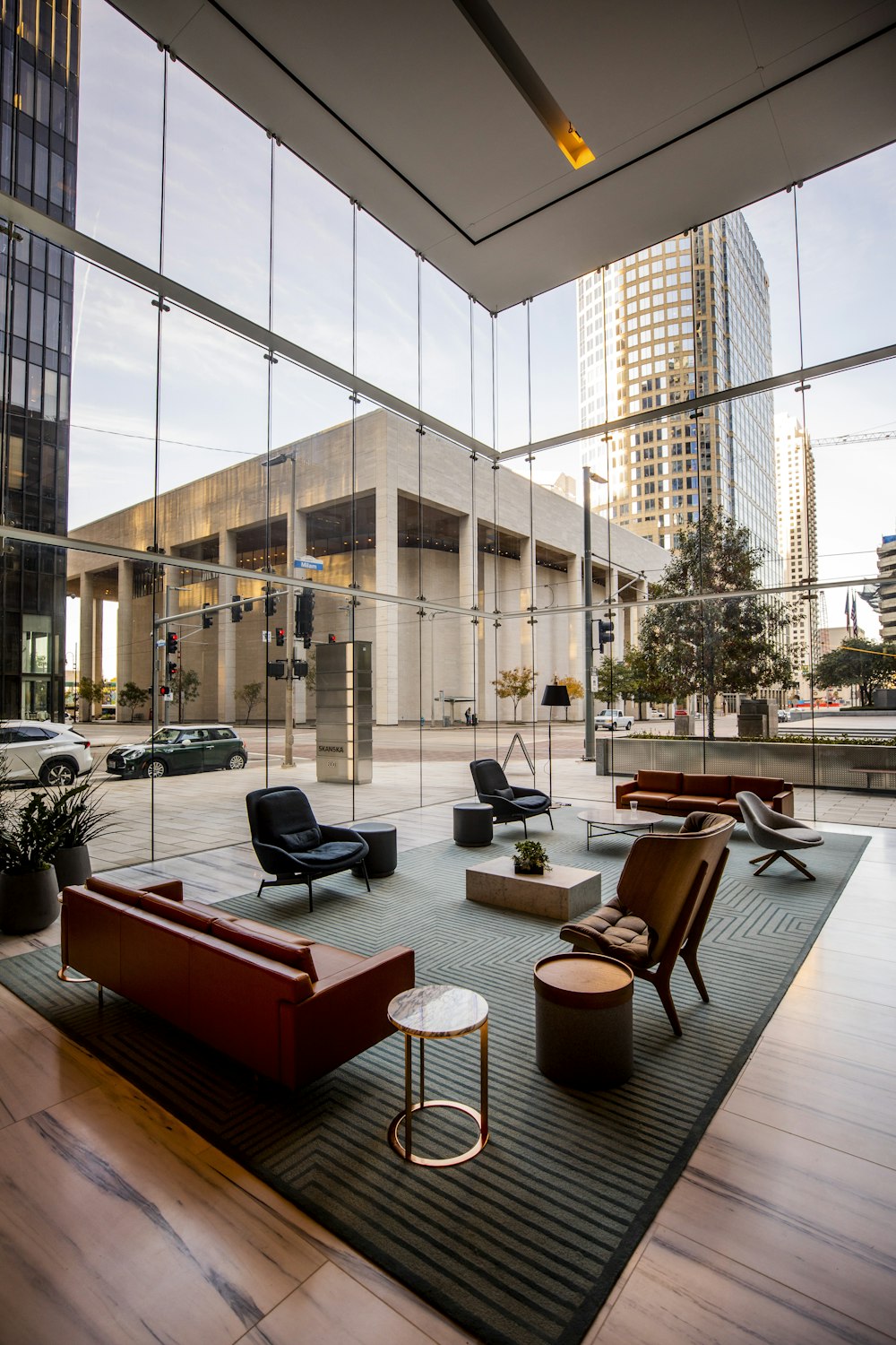 Double-height reception lounge with full-height glazing and street access