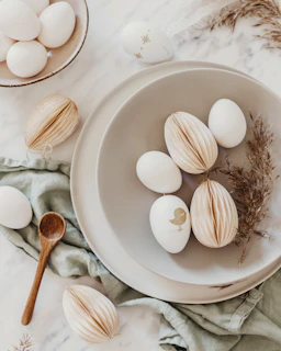 Eggs arranged artfully on a weathered farm table, highlighting their natural beauty.