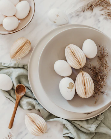Eggs arranged artfully on a weathered farm table, highlighting their natural beauty.
