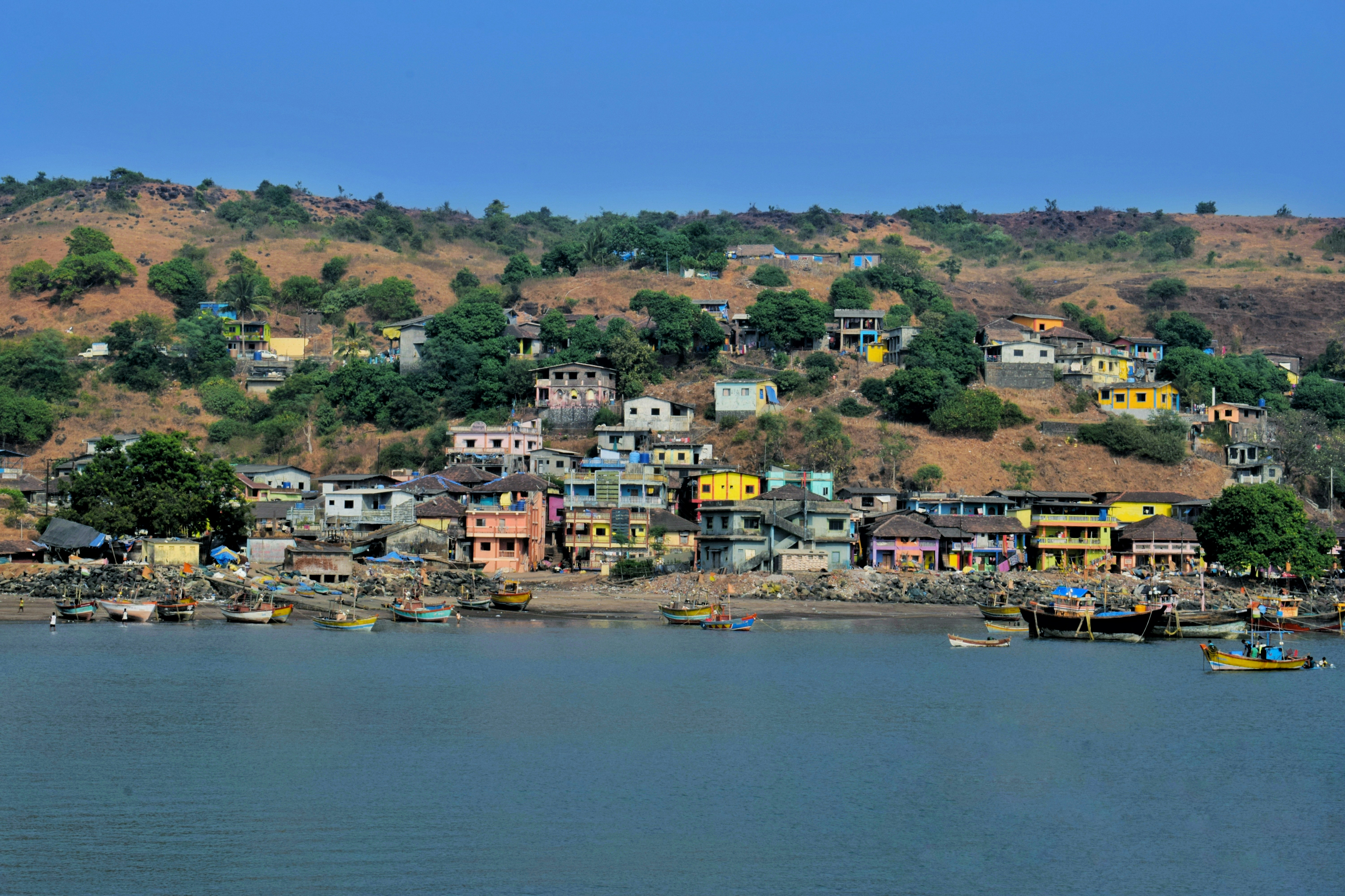 city near body of water during daytime