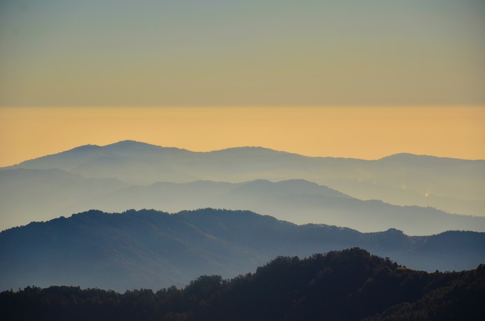 silhouette of mountains during sunset