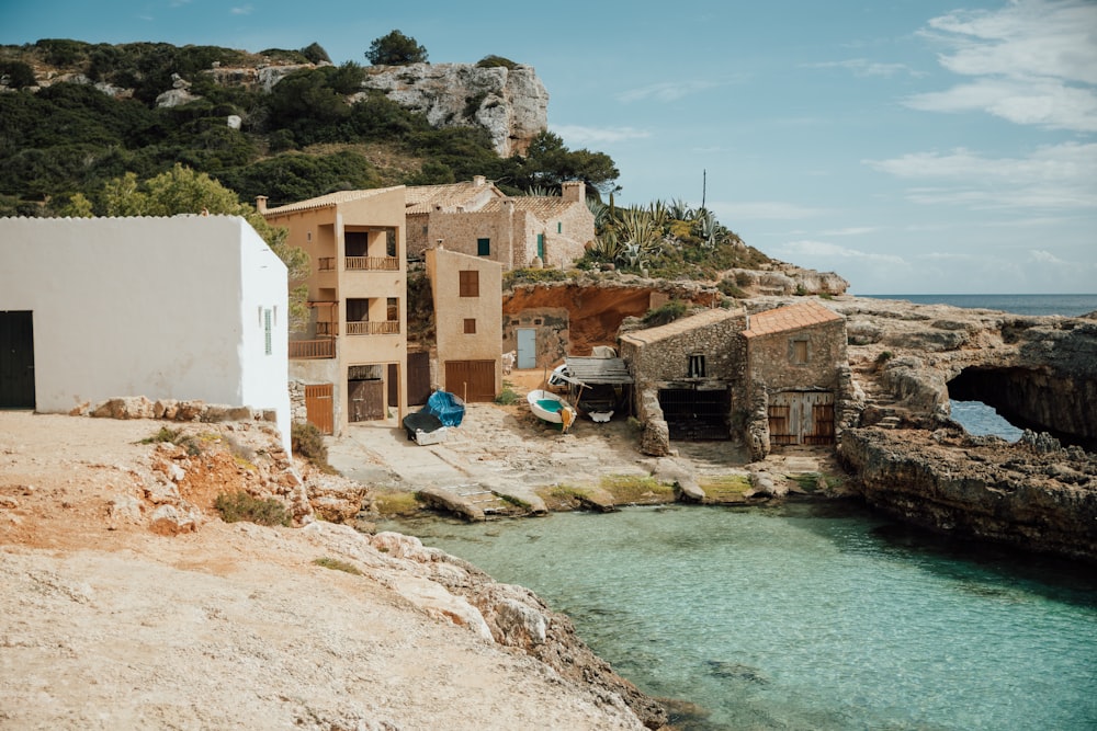 brown concrete building near body of water during daytime