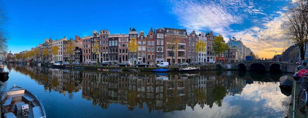 brown and white concrete building beside body of water during daytime