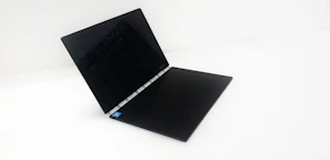 A sleek laptop displaying cybersecurity software on the screen.