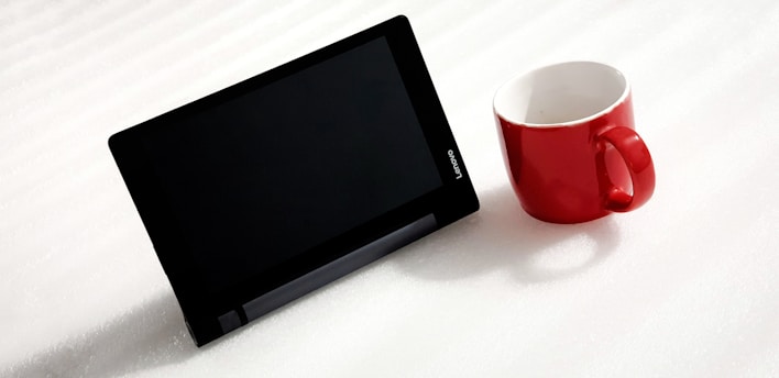 black flat screen tv on white table