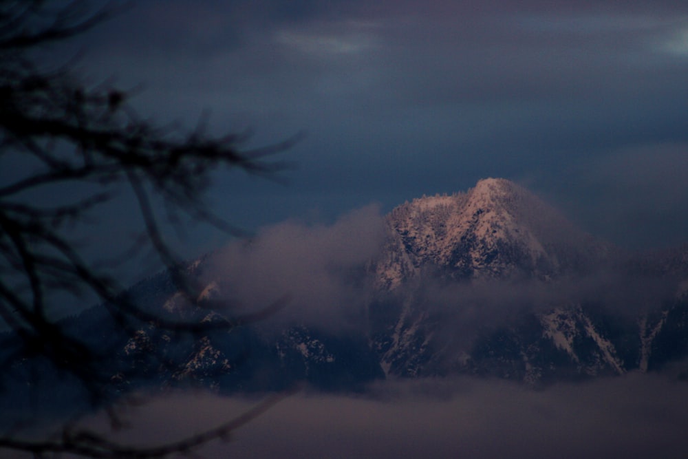 brown mountain under white clouds