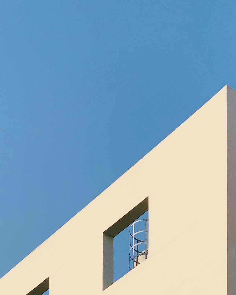 white concrete building under blue sky during daytime