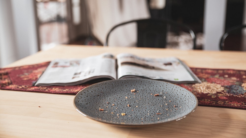 black round plate on brown wooden table