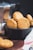 brown cookies in black ceramic bowl