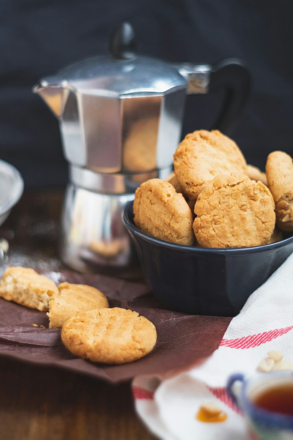 brown cookies on black ceramic bowl