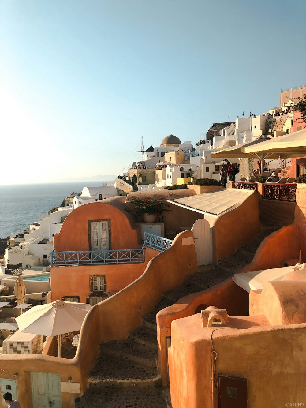 brown concrete houses near sea during daytime