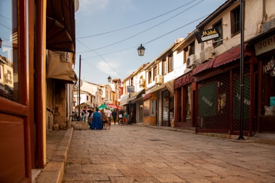 people walking on street between buildings during daytime north macedonia zoom background